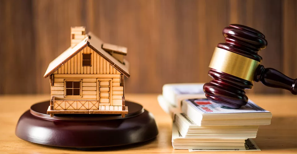 Gavel justice hammer and wood house on wood background