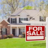 Home For Sale Real Estate Sign and House