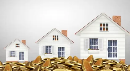 Mortgage concept by money house from coins