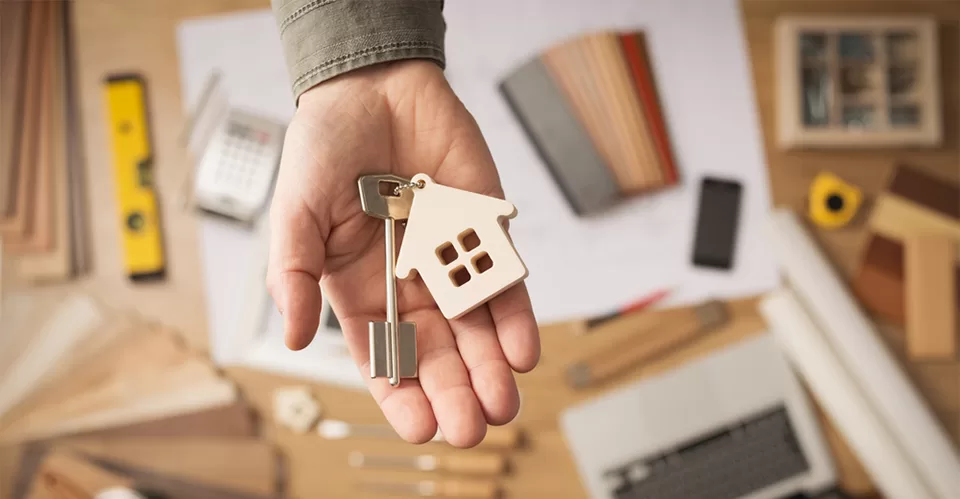 Real estate agent with house key