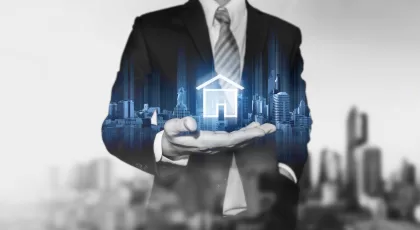 a graphic image of a man in a business suit with an icon of a house floating on his hand