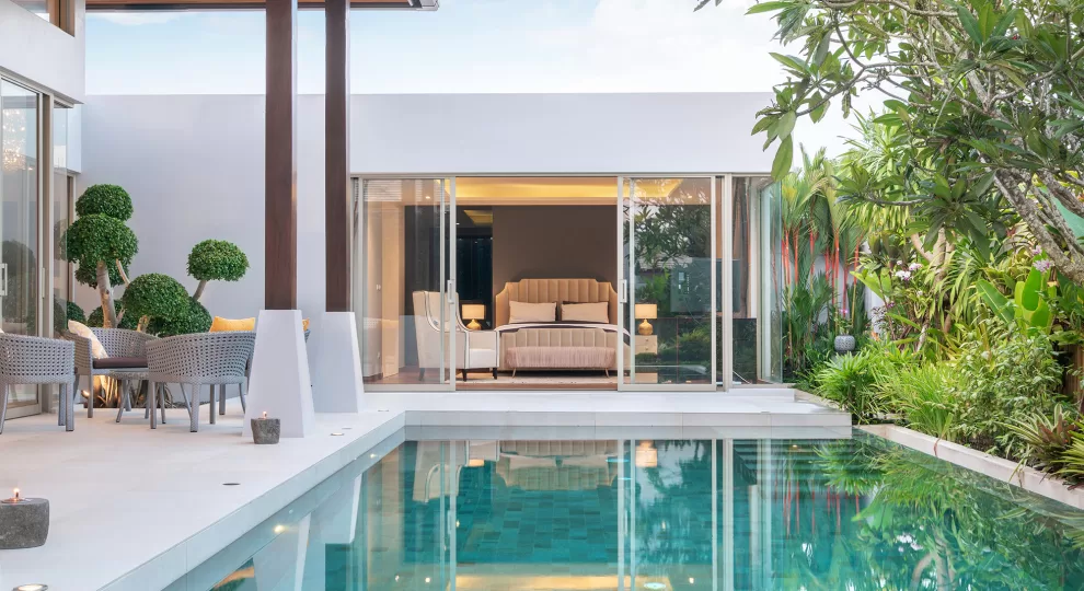 a white modern house with a pool