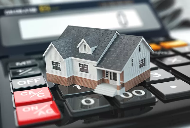 tiny model house on a mortgage calculator