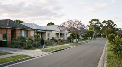 Ordinary Australian suburban street of varied homes, each seller choosing their own advertising
